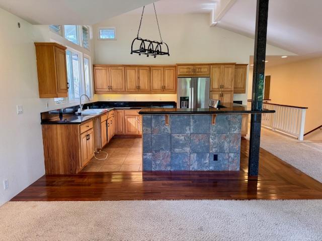 78-6694 Mamalahoa Hwy, Holualoa, HI 96740 - kitchen featuring stainless steel fridge, light colored carpet, dark countertops, high vaulted ceiling, and beam ceiling