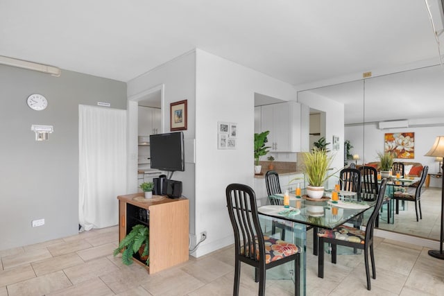 75-5719 Alii Dr Unit 314, Kailua-Kona, HI 96740 - dining area featuring a wall mounted air conditioner