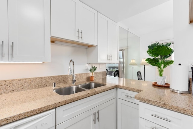75-5719 Alii Dr Unit 314, Kailua-Kona, HI 96740 - kitchen featuring dishwasher, white cabinetry, and light stone counters