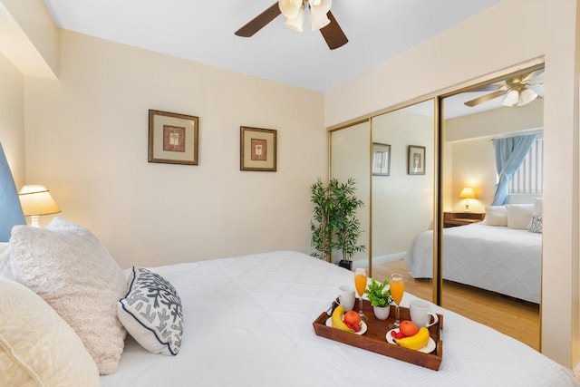 75-5719 Alii Dr Unit 314, Kailua-Kona, HI 96740 - bedroom with wood finished floors, a ceiling fan, and a closet