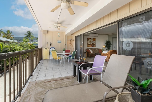 75-5719 Alii Dr Unit 314, Kailua-Kona, HI 96740 - balcony with ceiling fan, outdoor dining area, and a wall unit AC