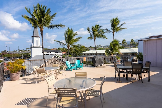 75-5719 Alii Dr Unit 314, Kailua-Kona, HI 96740 - view of patio with outdoor dining area and a grill