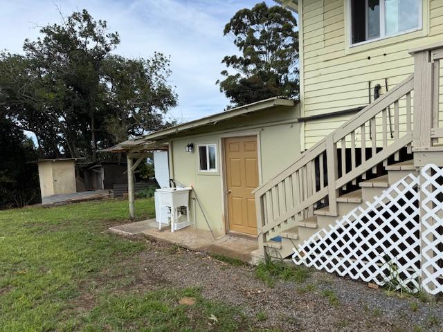 46-4180 Honokaa Waipio Rd, Honokaa, HI 96727 - back of property with stairs, a lawn, and an outbuilding