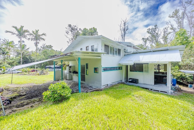 12-557 Hawaii St, Pahoa, HI 96778 - back of house featuring a lawn and a metal roof
