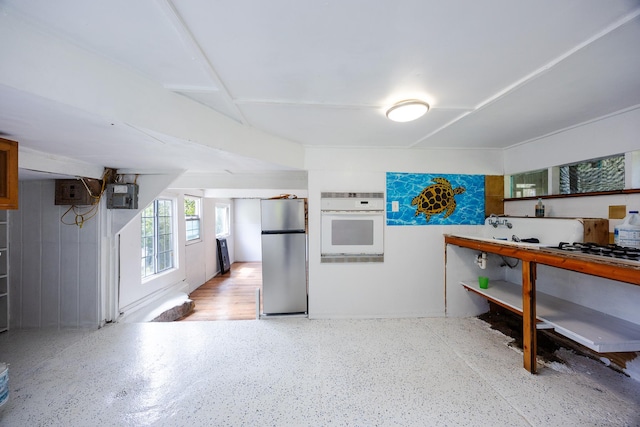 12-557 Hawaii St, Pahoa, HI 96778 - kitchen featuring freestanding refrigerator, white oven, and gas stovetop