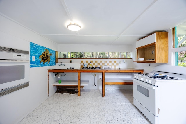12-557 Hawaii St, Pahoa, HI 96778 - kitchen featuring white appliances, white cabinetry, and open shelves
