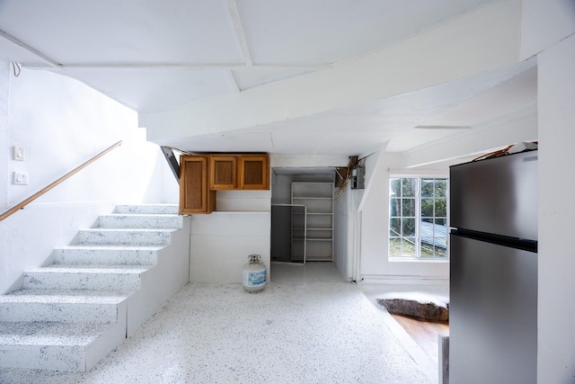12-557 Hawaii St, Pahoa, HI 96778 - basement featuring freestanding refrigerator and stairs