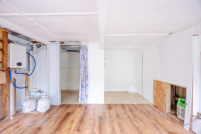 12-557 Hawaii St, Pahoa, HI 96778 - finished below grade area featuring wood finished floors and water heater
