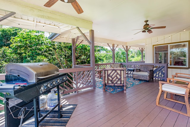 28-238 Akaka Falls Rd, Honomu, HI 96728 - wooden deck with ceiling fan, a grill, and an outdoor hangout area