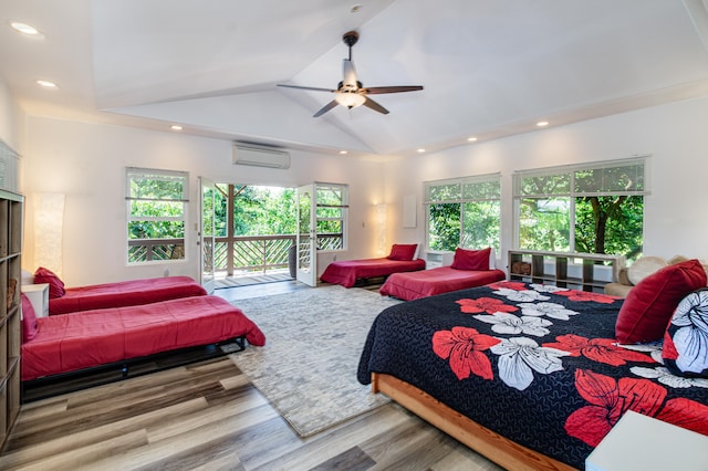 28-238 Akaka Falls Rd, Honomu, HI 96728 - bedroom with access to exterior, wood finished floors, a wall unit AC, lofted ceiling, and recessed lighting