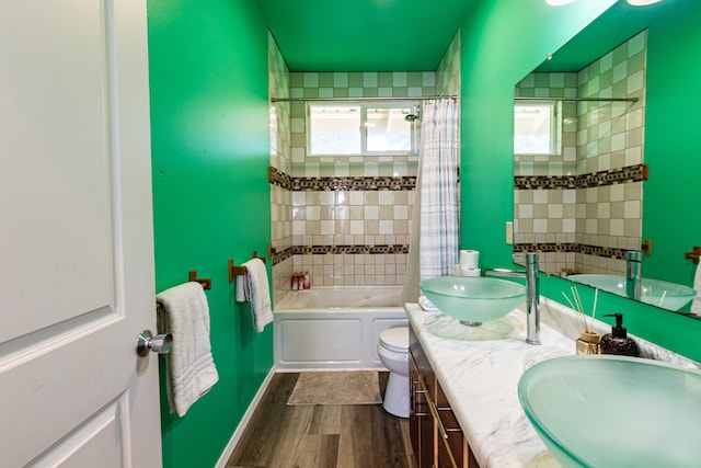 28-238 Akaka Falls Rd, Honomu, HI 96728 - full bathroom with double vanity, wood finished floors, shower / tub combo, and plenty of natural light