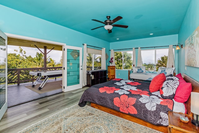 28-238 Akaka Falls Rd, Honomu, HI 96728 - bedroom with access to outside, wood finished floors, and a ceiling fan