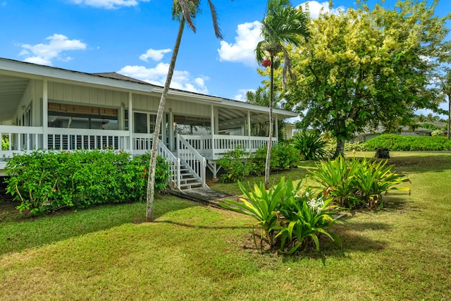 3795 Kelii Pl, Princeville, HI 96722 - view of grassy yard featuring a sunroom