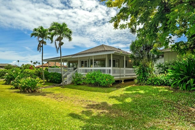 3795 Kelii Pl, Princeville, HI 96722 - rear view of property featuring a lawn