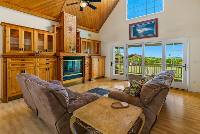 6201-B Kawaiihau Rd Unit B, Kapaa, HI 96746 - living area with high vaulted ceiling, wood ceiling, ceiling fan, light wood-style floors, and a glass covered fireplace