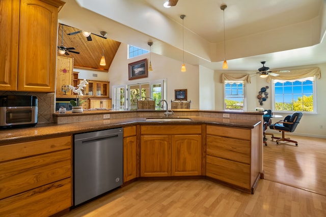 6201-B Kawaiihau Rd Unit B, Kapaa, HI 96746 - kitchen with stainless steel dishwasher, brown cabinetry, light wood finished floors, and high vaulted ceiling