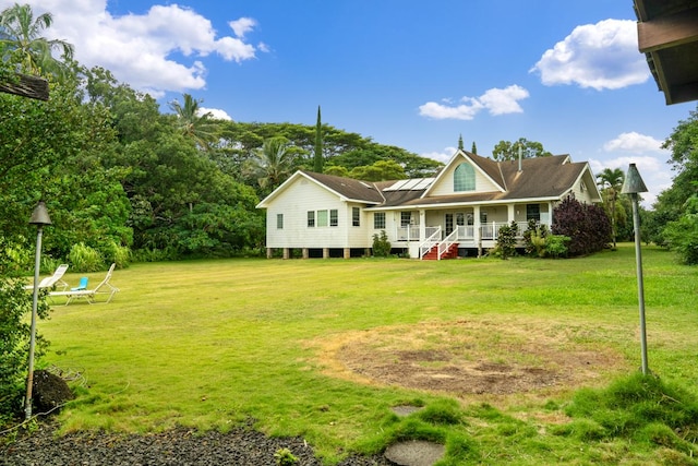 6201-B Kawaiihau Rd Unit B, Kapaa, HI 96746 - farmhouse-style home with a porch and a front yard