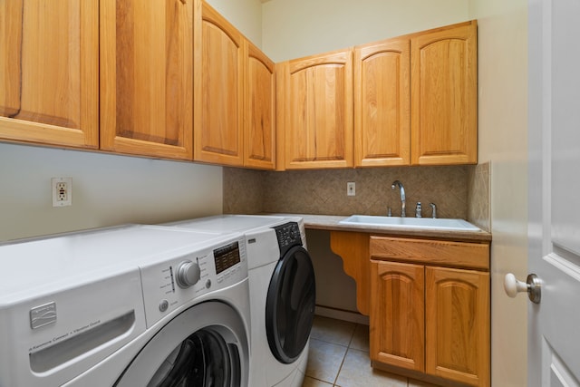6201-B Kawaiihau Rd Unit B, Kapaa, HI 96746 - washroom featuring washer and clothes dryer, cabinet space, and light tile patterned flooring