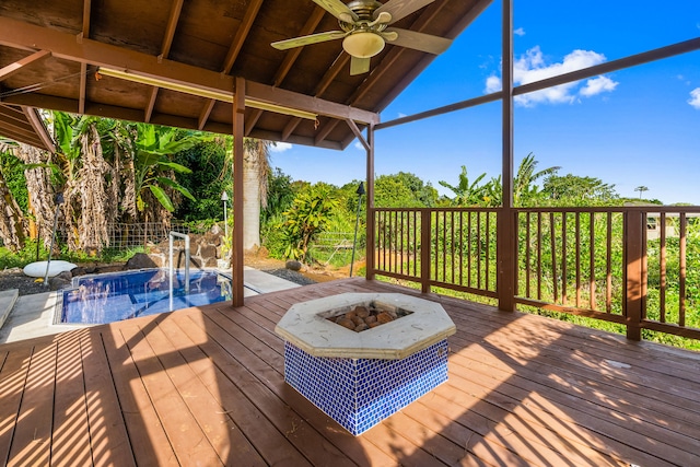 6201-B Kawaiihau Rd Unit B, Kapaa, HI 96746 - wooden deck featuring a fire pit, a ceiling fan, and an outdoor pool
