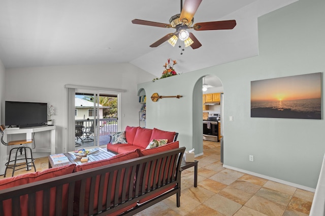 55-548 Hawi Rd, Hawi, HI 96719 - living room with lofted ceiling, a ceiling fan, arched walkways, and light stone finish flooring