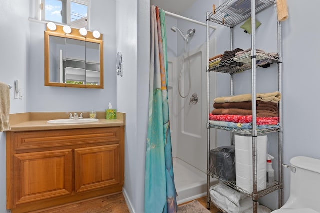 55-548 Hawi Rd, Hawi, HI 96719 - bathroom featuring a shower with shower curtain, vanity, and wood finished floors