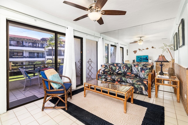 75-6082 Alii Dr Unit A207, Kailua-Kona, HI 96740 - tiled living room featuring a ceiling fan and healthy amount of natural light