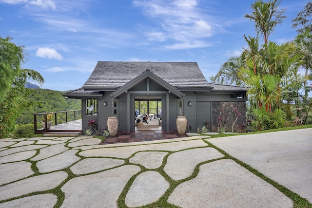 6003-B Halaulani Pl Unit 2, Kilauea, HI 96754 - back of house with a wooden deck and stone siding