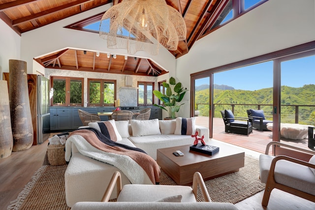 6003-B Halaulani Pl Unit 2, Kilauea, HI 96754 - living area featuring a wood ceiling with exposed beams, high vaulted ceiling, wood finished floors, plenty of natural light, and a mountain view