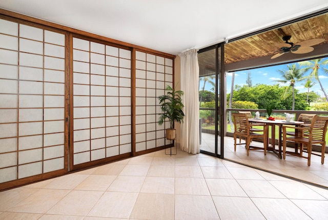 78-6800 Alii Dr Unit 7202, Kailua-Kona, HI 96740 - spare room featuring ceiling fan, expansive windows, and light tile patterned flooring
