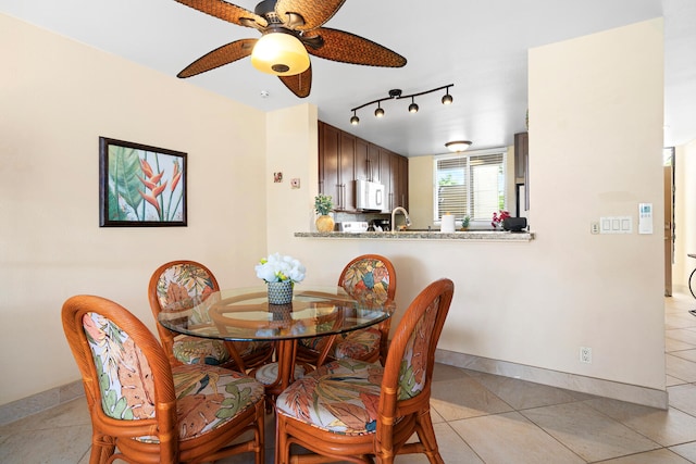 78-6800 Alii Dr Unit 7202, Kailua-Kona, HI 96740 - dining space featuring a ceiling fan, light tile patterned flooring, and track lighting