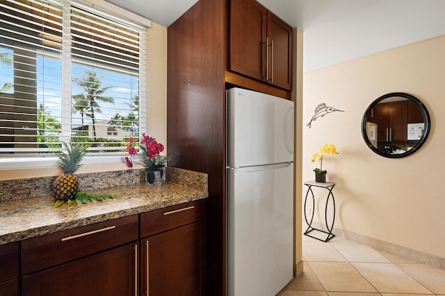 78-6800 Alii Dr Unit 7202, Kailua-Kona, HI 96740 - kitchen featuring freestanding refrigerator, light tile patterned floors, healthy amount of natural light, and light stone countertops
