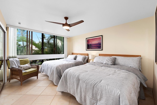 78-6800 Alii Dr Unit 7202, Kailua-Kona, HI 96740 - bedroom featuring light tile patterned floors, expansive windows, and ceiling fan