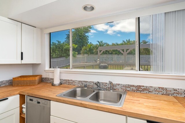 68-1760 Nawili Pl, Waikoloa, HI 96738 - kitchen featuring butcher block countertops, dishwasher, and white cabinetry