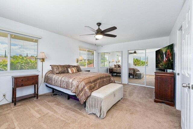 68-1760 Nawili Pl, Waikoloa, HI 96738 - bedroom with light carpet, two closets, and a ceiling fan