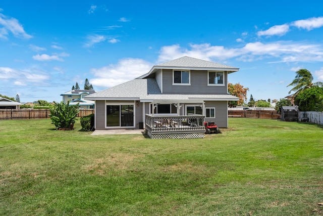 68-1760 Nawili Pl, Waikoloa, HI 96738 - rear view of house with a fenced backyard, roof with shingles, and a deck