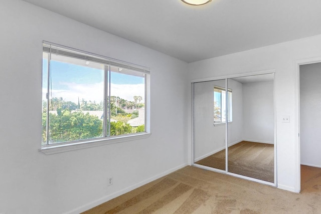 68-1760 Nawili Pl, Waikoloa, HI 96738 - unfurnished bedroom featuring multiple windows, carpet floors, and a closet