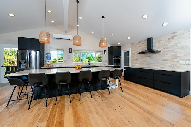 68-1785 Niu Haohao Pl, Waikoloa, HI 96738 - kitchen featuring wall chimney exhaust hood, stainless steel appliances, dark cabinetry, modern cabinets, and recessed lighting