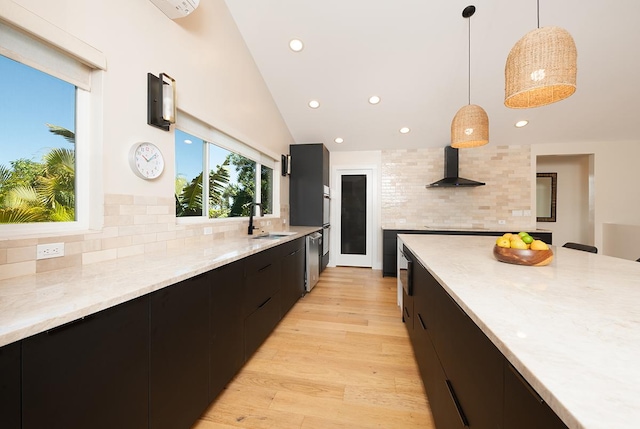 68-1785 Niu Haohao Pl, Waikoloa, HI 96738 - kitchen featuring wall chimney range hood, dark cabinetry, modern cabinets, decorative backsplash, and pendant lighting