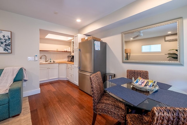 68-1785 Niu Haohao Pl, Waikoloa, HI 96738 - dining area featuring a wall unit AC, dark wood-style floors, and recessed lighting