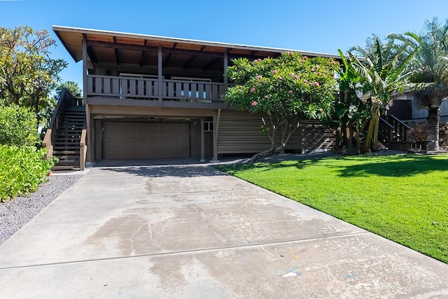 68-1785 Niu Haohao Pl, Waikoloa, HI 96738 - view of front of property featuring stairway, a front yard, an attached garage, and concrete driveway