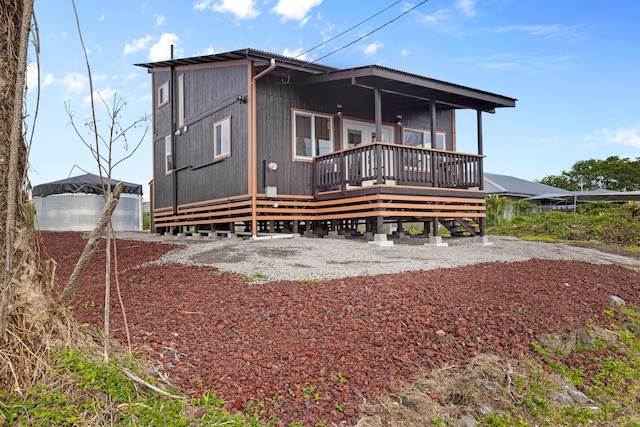 16-2078 Mauna Kea Dr, Pahoa, HI 96778 - rear view of house featuring a wooden deck