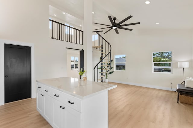 16-2078 Mauna Kea Dr, Pahoa, HI 96778 - kitchen with a ceiling fan, high vaulted ceiling, white cabinetry, light wood-type flooring, and open floor plan