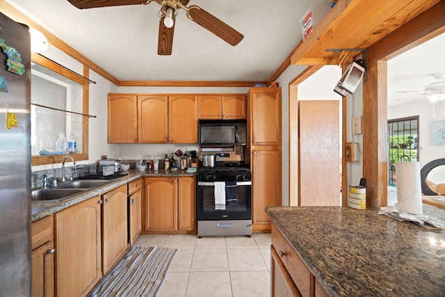 7786 Ulili Rd, Kekaha, HI 96752 - kitchen with a ceiling fan, appliances with stainless steel finishes, light tile patterned floors, dark stone countertops, and crown molding