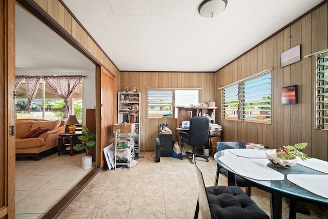 7786 Ulili Rd, Kekaha, HI 96752 - home office with healthy amount of natural light, wood walls, light tile patterned flooring, and ornamental molding