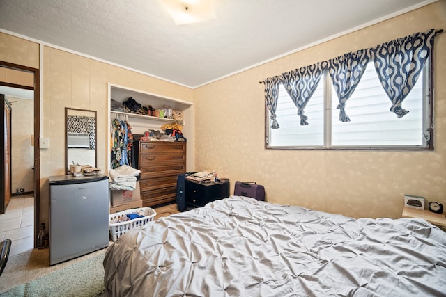 7786 Ulili Rd, Kekaha, HI 96752 - bedroom with freestanding refrigerator, a closet, and ornamental molding