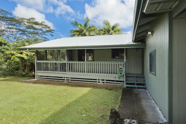 15-2736 Ahi St, Pahoa, HI 96778 - view of front of home with a front yard and a metal roof