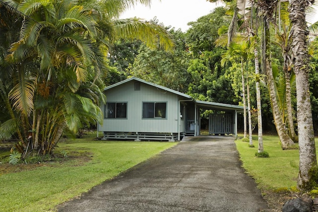 15-2736 Ahi St, Pahoa, HI 96778 - view of front of home featuring asphalt driveway, a front yard, and a carport