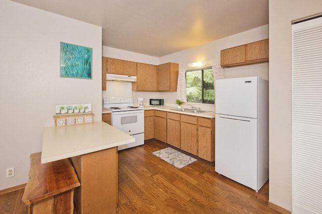 15-2736 Ahi St, Pahoa, HI 96778 - kitchen with white appliances, under cabinet range hood, a peninsula, light countertops, and dark wood-type flooring