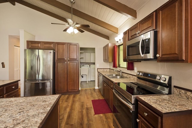 15-2736 Ahi St, Pahoa, HI 96778 - kitchen with appliances with stainless steel finishes, separate washer and dryer, dark wood-style flooring, and a ceiling fan
