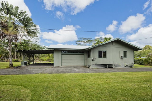 15-2736 Ahi St, Pahoa, HI 96778 - view of front of house with a carport, a front yard, driveway, and an attached garage